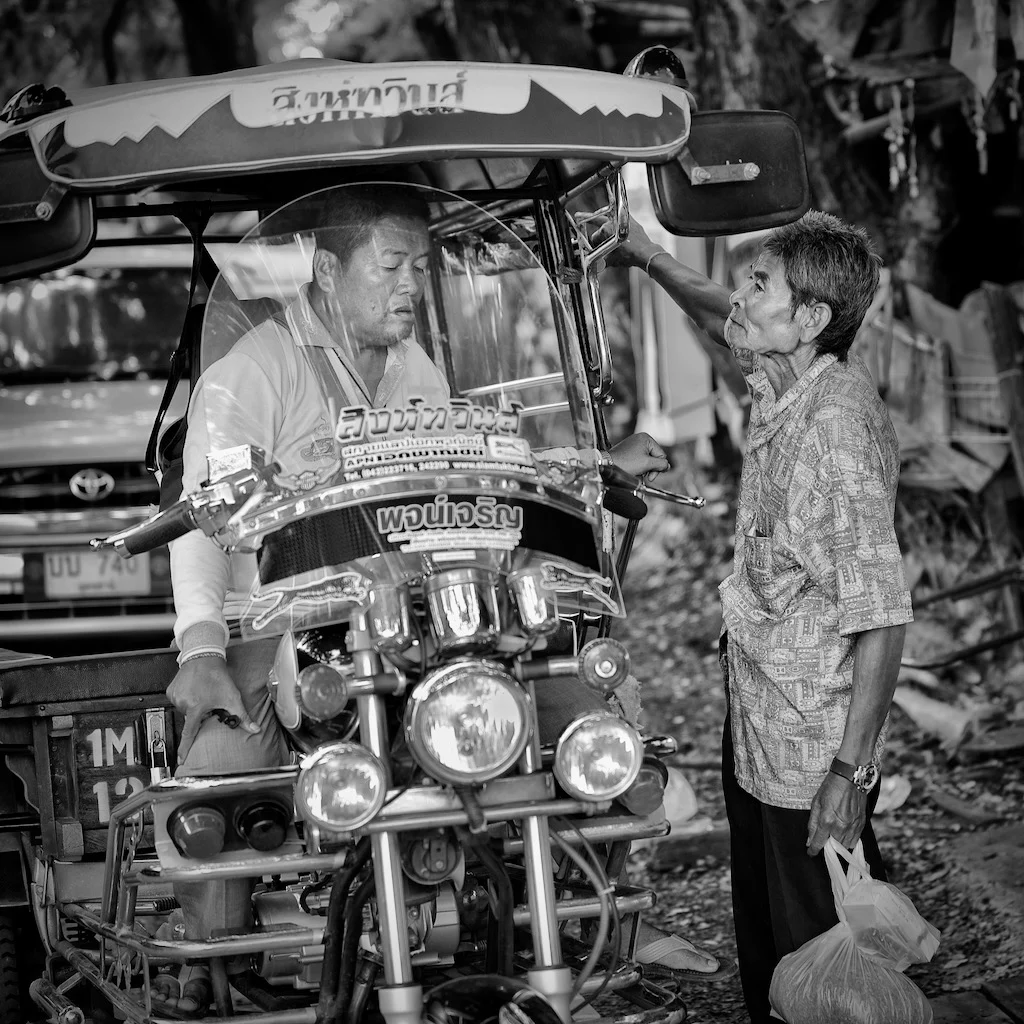 Negotiating a tuk-tuk ride in Thailand, spotted by Peter Pickering